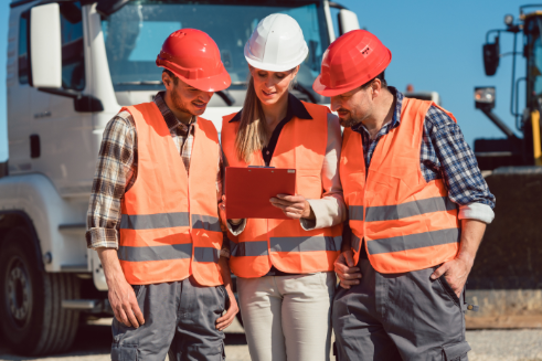 Happy customers reviewing information on a tablet